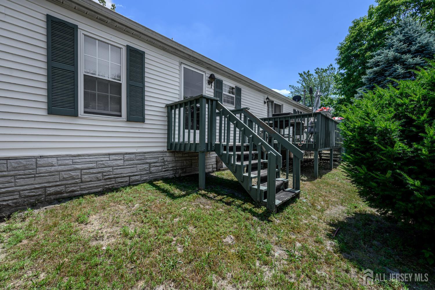 8 Snow Chief Court Howell, NJ 07731 - Photo 25 of 26 a view of a house with wooden deck