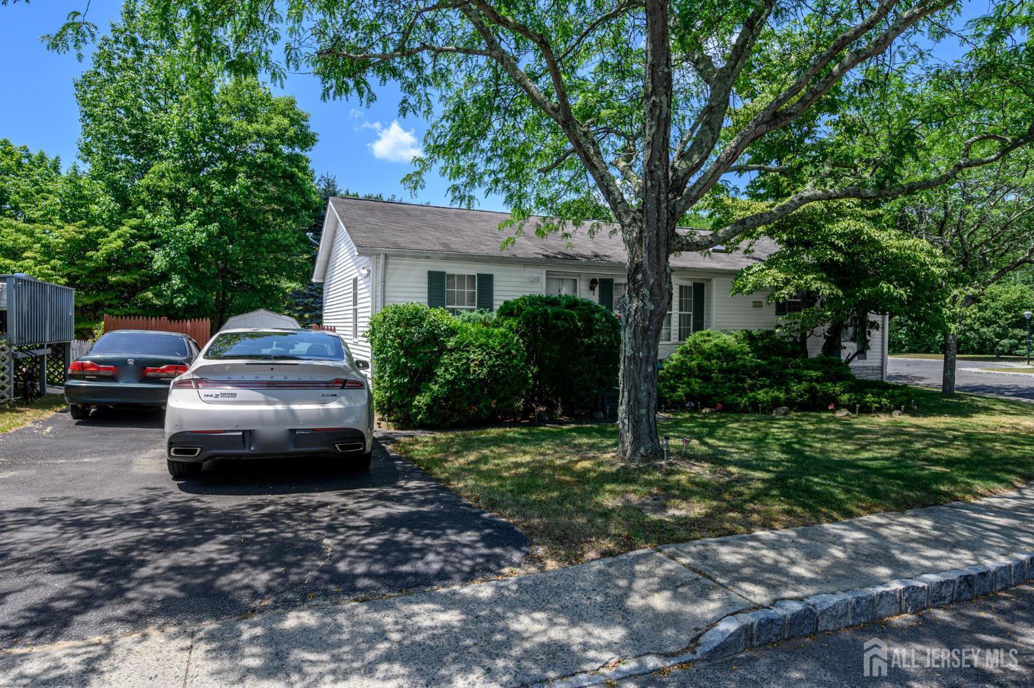 8 Snow Chief Court Howell, NJ 07731 - Photo 26 of 26 a view of a car parked in front of a house