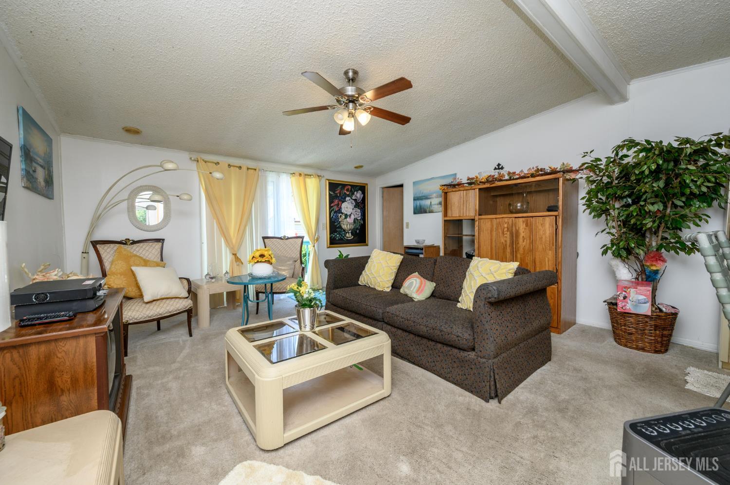 8 Snow Chief Court Howell, NJ 07731 - Photo 4 of 26 a living room with furniture and a large window
