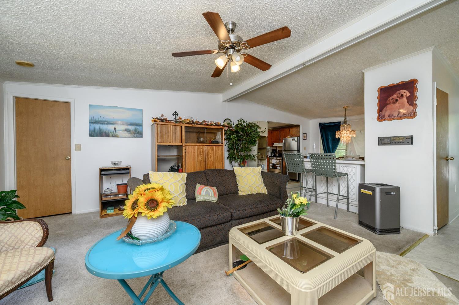 8 Snow Chief Court Howell, NJ 07731 - Photo 5 of 26 a living room with furniture and kitchen view