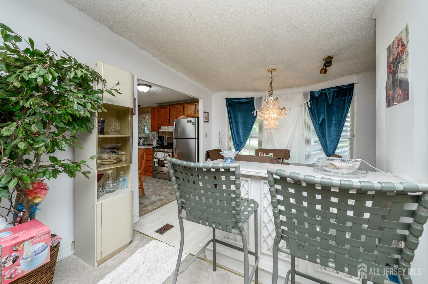 8 Snow Chief Court Howell, NJ 07731 - Photo 6 of 26 a kitchen with a table and chairs in it