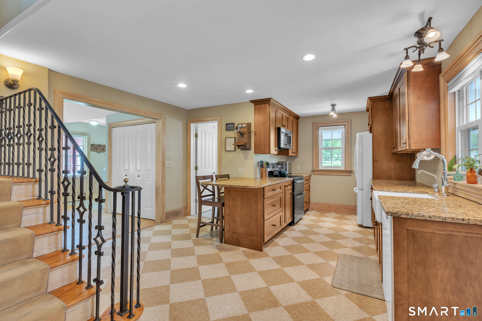 808 Branch Road Suffield, CT 06078 - Photo 7 of 40 a kitchen with stainless steel appliances granite countertop a refrigerator and a sink