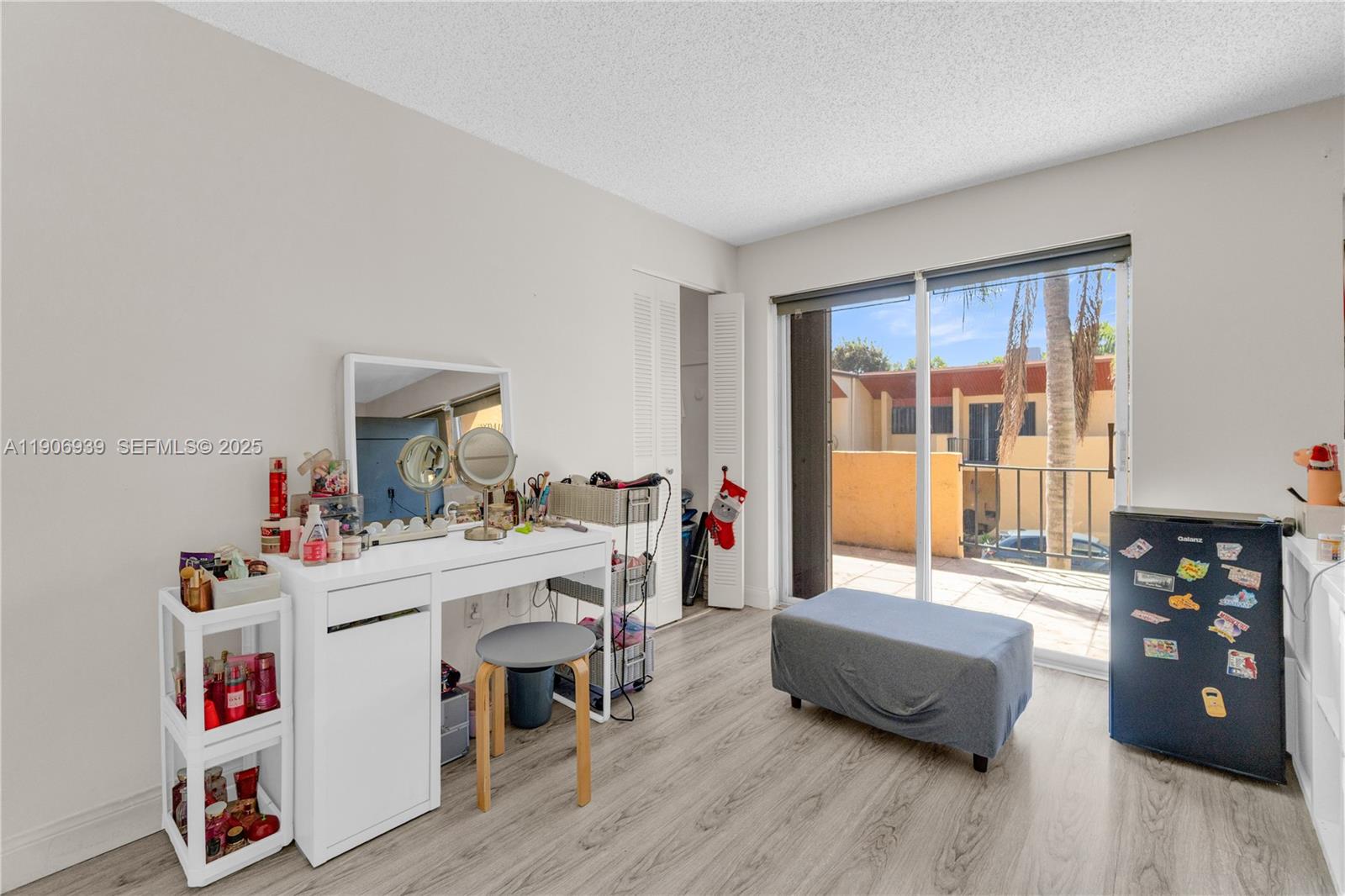 13715 Southwest 84th Street, Unit F Miami, FL 33143 - Photo 20 of 30 a living room with furniture and wooden floor