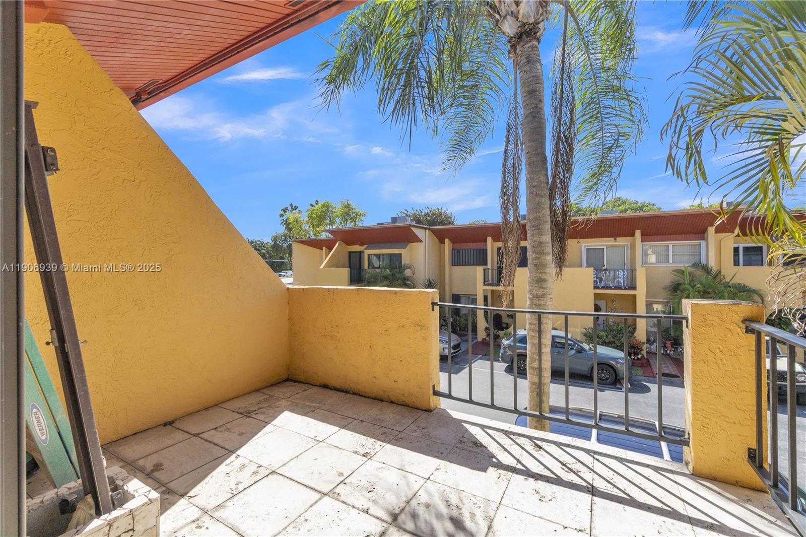 13715 Southwest 84th Street, Unit F Miami, FL 33143 - Photo 24 of 30 a view of a patio with a table and chairs