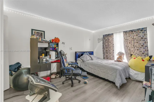 a bedroom with bed and a couch