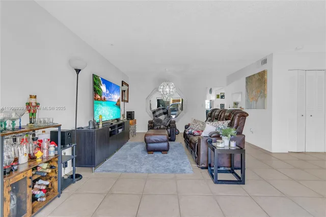 a living room with lots of furniture and a flat screen tv
