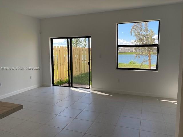 10166 Southwest 228th Terrace Miami, FL 33190 - Photo 11 of 29 an empty room with windows and closet