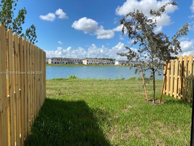10166 Southwest 228th Terrace Miami, FL 33190 - Photo 12 of 29 a view of a lake with a big yard