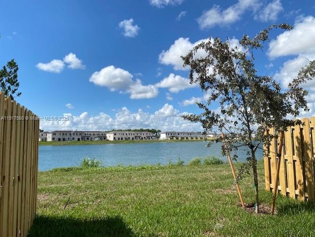 10166 Southwest 228th Terrace Miami, FL 33190 - Photo 13 of 29 a view of a lake with a city