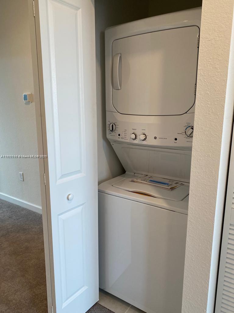 10166 Southwest 228th Terrace Miami, FL 33190 - Photo 18 of 29 a utility room with dryer and washer