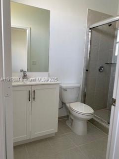 10166 Southwest 228th Terrace Miami, FL 33190 - Photo 21 of 29 a bathroom with a sink a toilet and shower