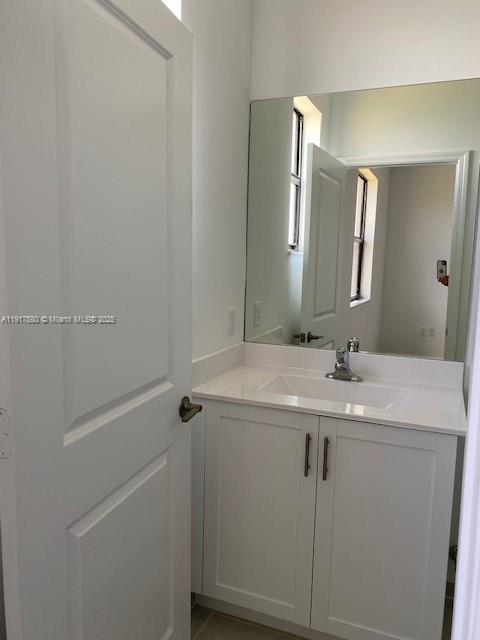 10166 Southwest 228th Terrace Miami, FL 33190 - Photo 26 of 29 a bathroom with a sink and mirror