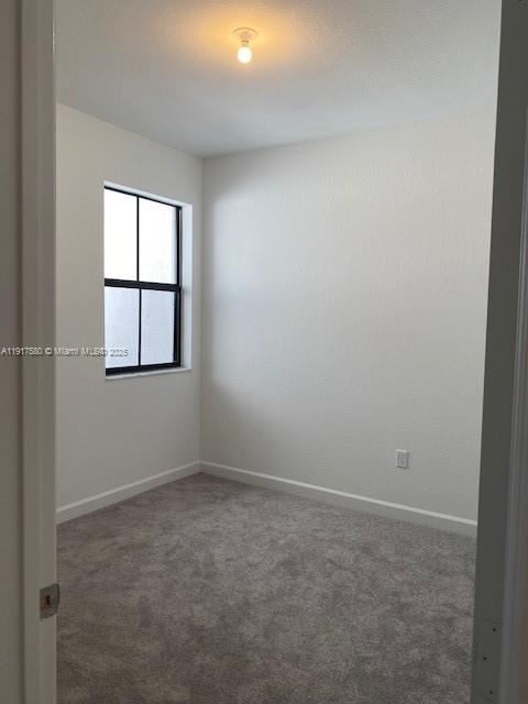10166 Southwest 228th Terrace Miami, FL 33190 - Photo 28 of 29 an empty room with windows