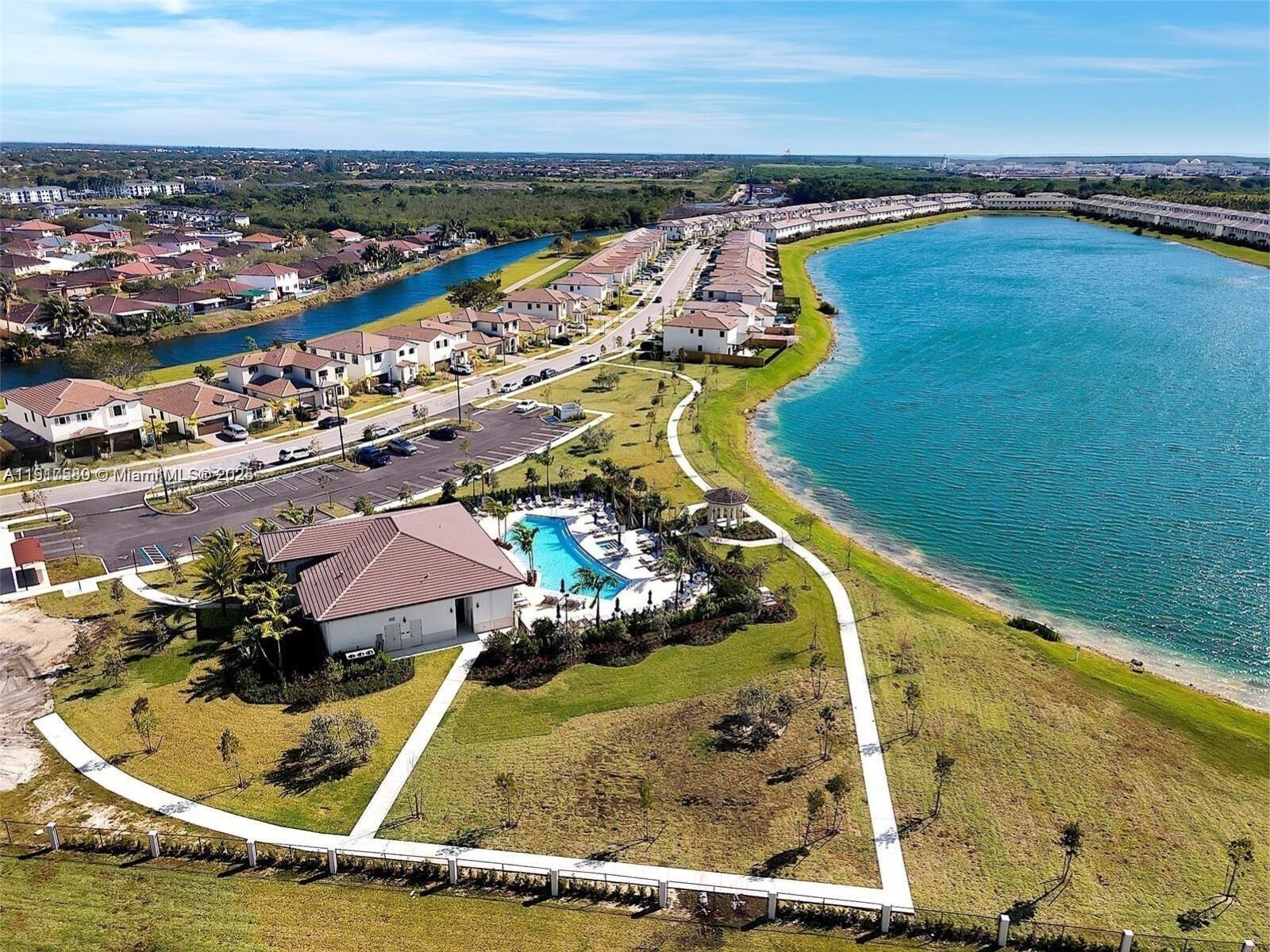 10166 Southwest 228th Terrace Miami, FL 33190 - Photo 5 of 29 a view of a swimming pool with an ocean view