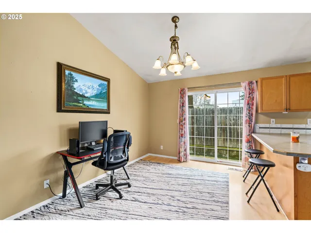 a view of a livingroom with furniture window and wooden floor
