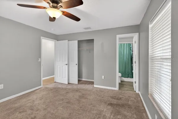 a view of an empty room with a window