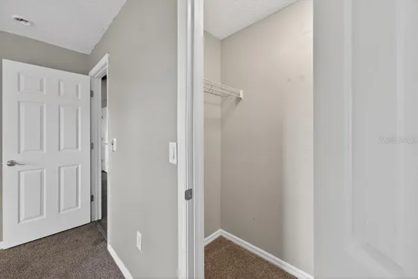 a view of a hallway with closet area
