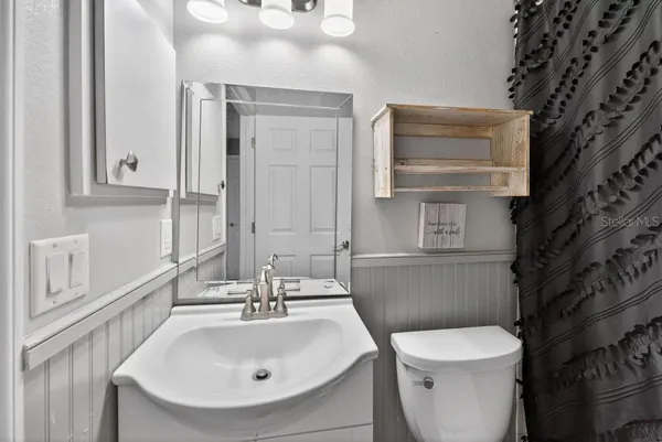 a view of a hallway with seating area