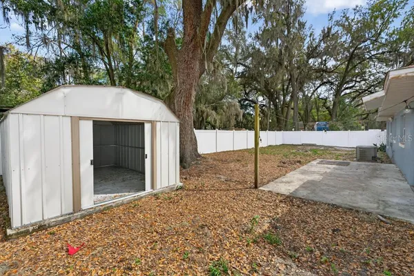 a backyard of a house with lots of green space