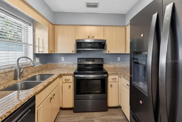 a kitchen with a stove and a microwave