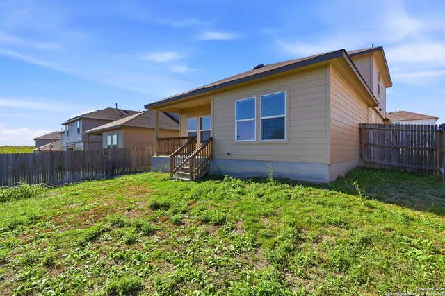 a backyard of a house with lots of green space