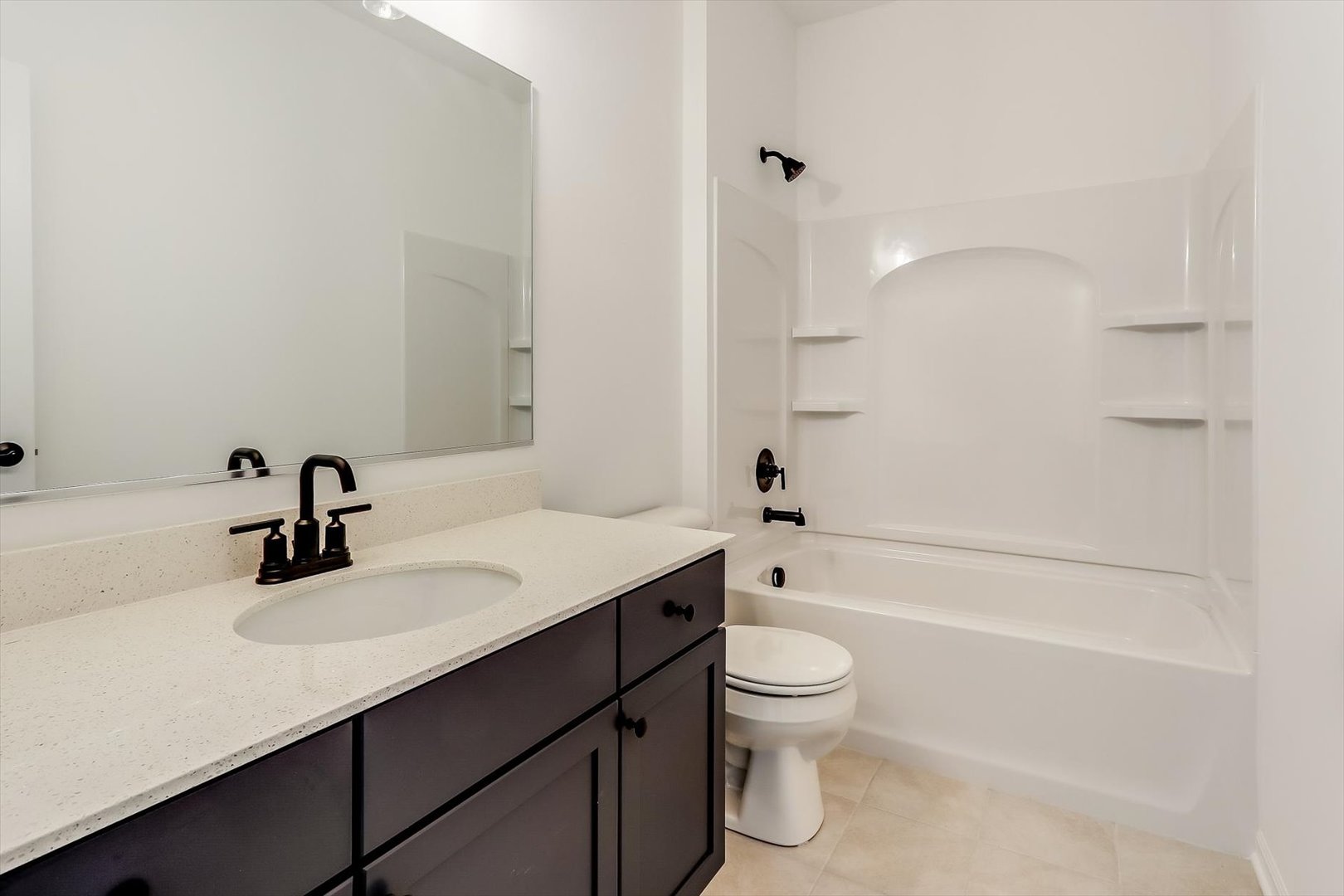 730 Alberta Avenue Oswego, IL 60543 - Photo 28 of 29 a bathroom with a sink mirror toilet and bathtub
