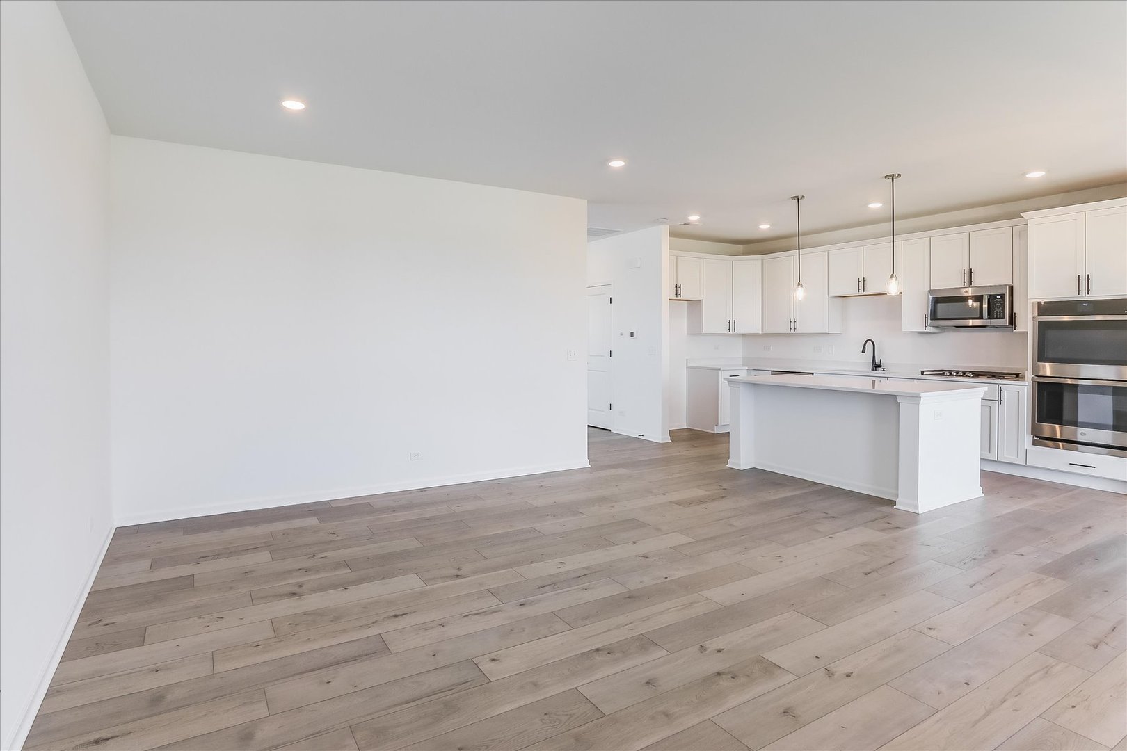 730 Alberta Avenue Oswego, IL 60543 - Photo 9 of 29 a view of kitchen with wooden floor and electronic appliances