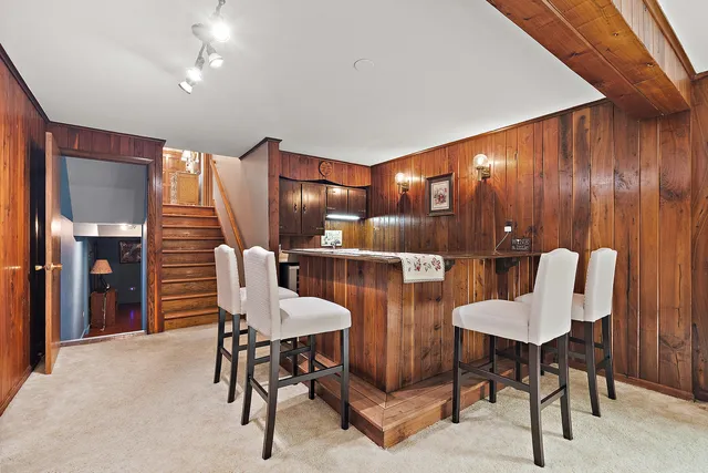 a dining room with furniture and chandelier