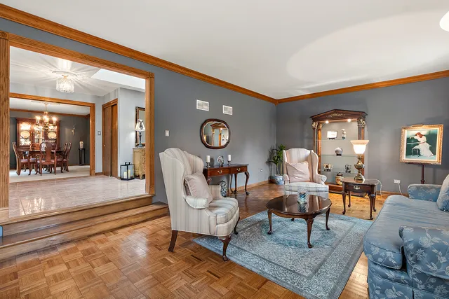 a living room with furniture a rug and a large window
