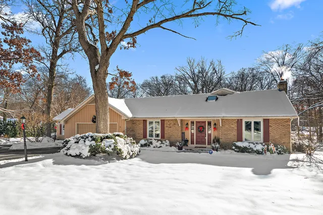 a view of a house with a snow in the yard