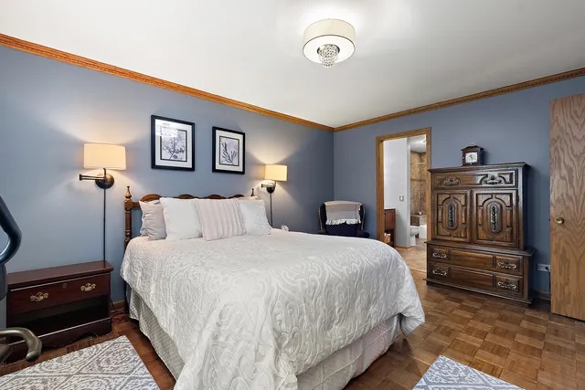 a bedroom with a bed and dresser