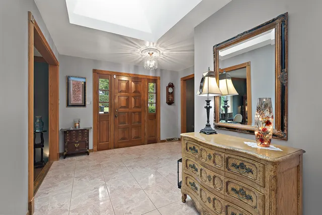 a spacious bathroom with a double vanity sink and a mirror