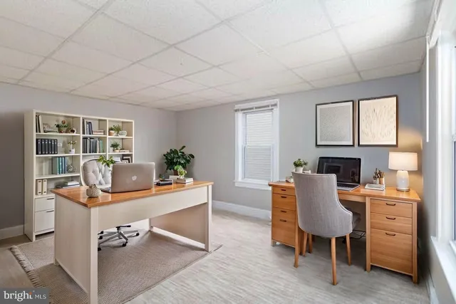 a bedroom with a bed and a flat screen television