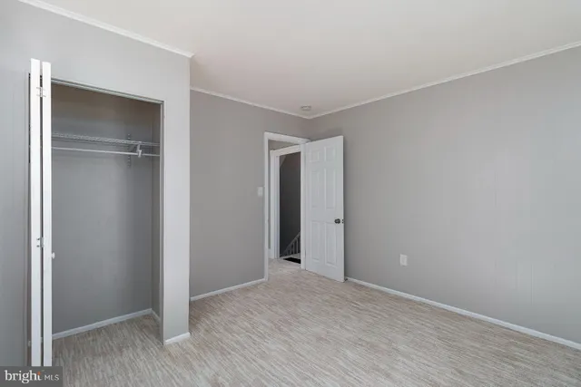 a bathroom with a sink a toilet a mirror and shower