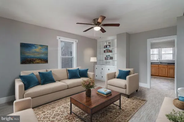 a living room with furniture and a window