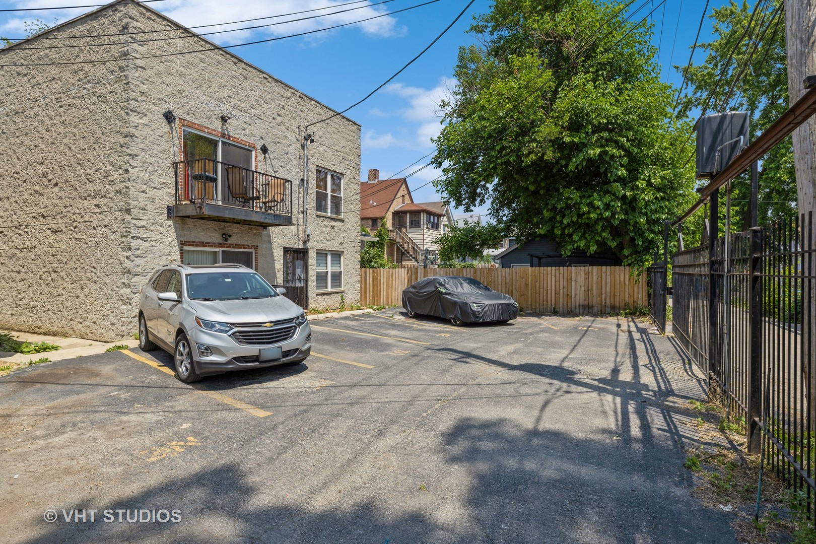 5931 West Huron Street, Unit 3N Chicago, IL 60644 - Photo 13 of 13 a car parked on the side of the road