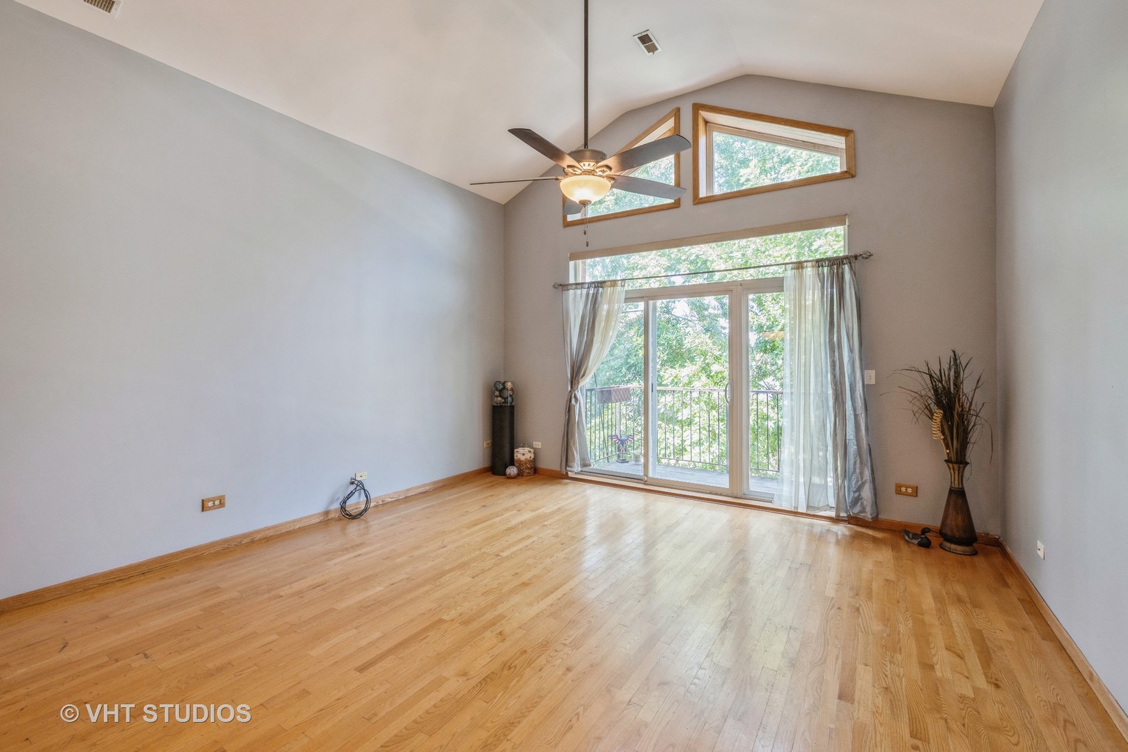 5931 West Huron Street, Unit 3N Chicago, IL 60644 - Photo 2 of 13 a view of empty room with wooden floor and fan