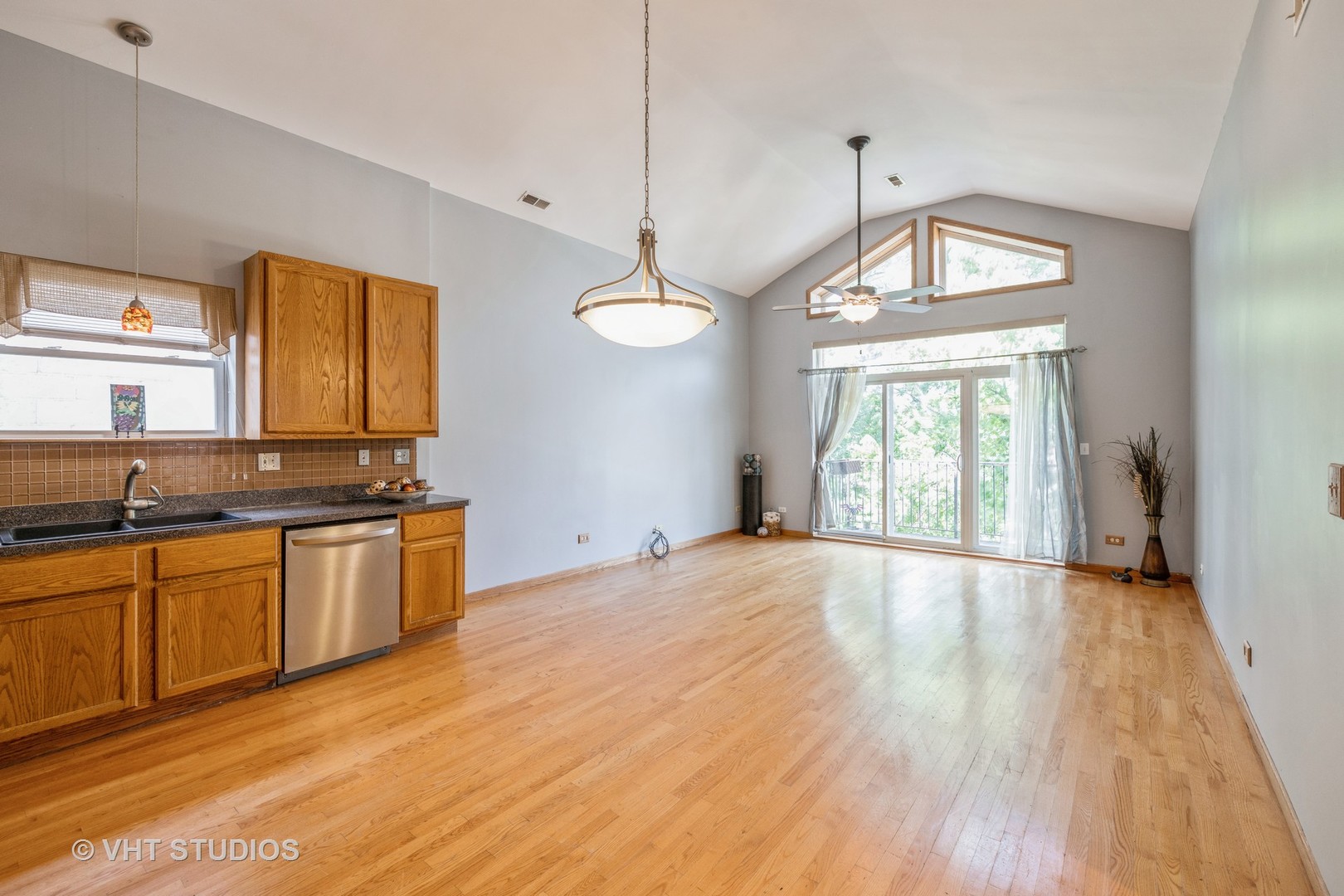 5931 West Huron Street, Unit 3N Chicago, IL 60644 - Photo 3 of 13 a view of a kitchen with a sink and wooden floor