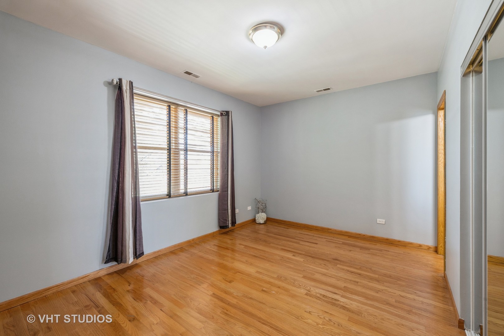 5931 West Huron Street, Unit 3N Chicago, IL 60644 - Photo 6 of 13 a view of an empty room with a window