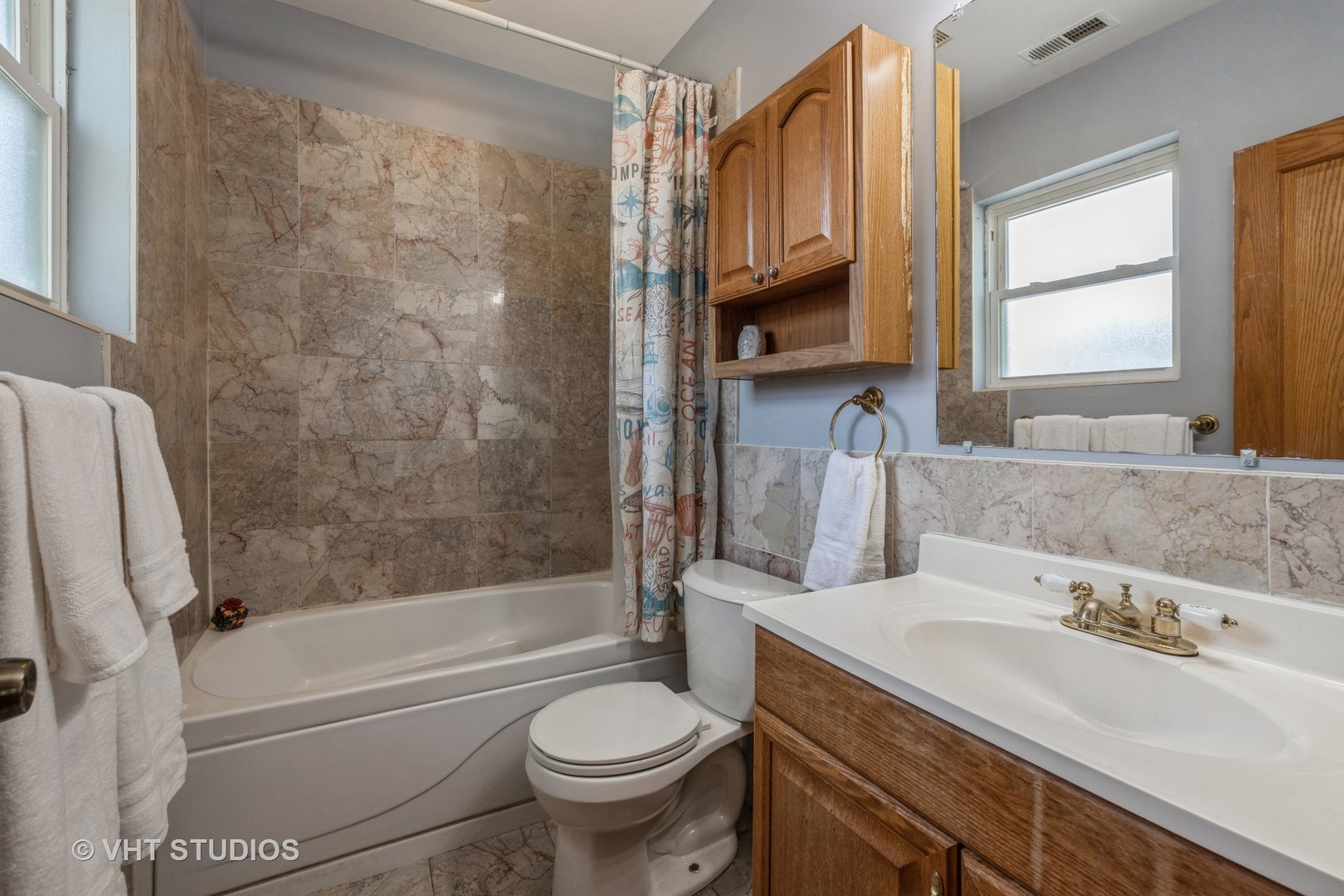 5931 West Huron Street, Unit 3N Chicago, IL 60644 - Photo 8 of 13 a bathroom with a sink toilet and shower