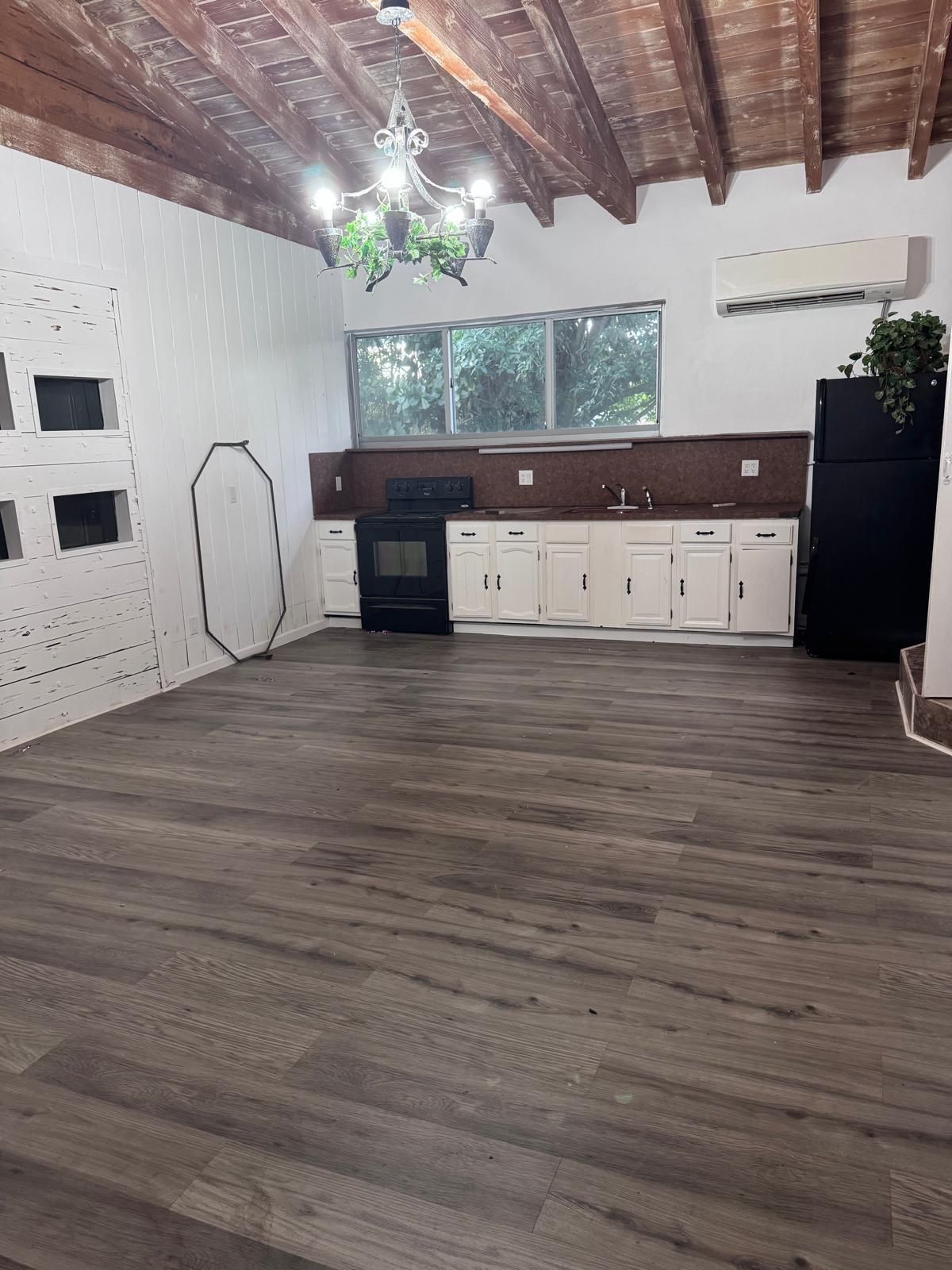 5250 Rock Island Road Tamarac, FL 33319 - Photo 2 of 6 a view of a room with wooden floor