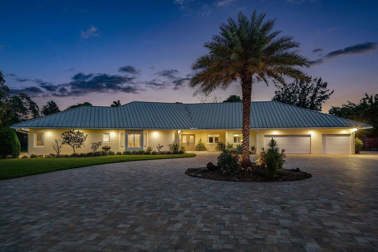 6624 Dillman Road Greenacres, FL 33413 - Photo 2 of 77 Twilight Front