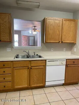 a kitchen with granite countertop cabinets and white appliances