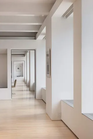 a view of a bedroom from a hallway