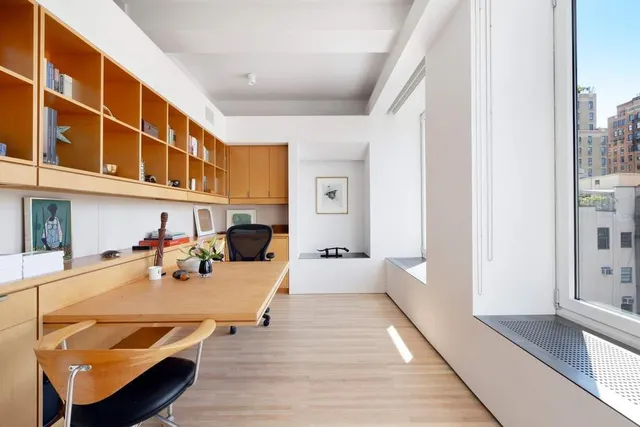 a view of a living room and kitchen