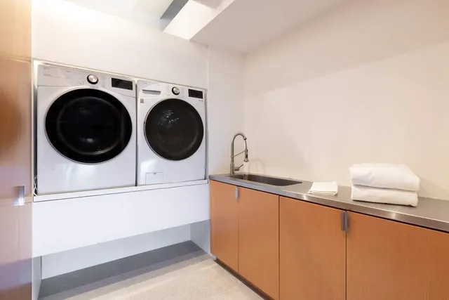 a utility room with dryer and washer