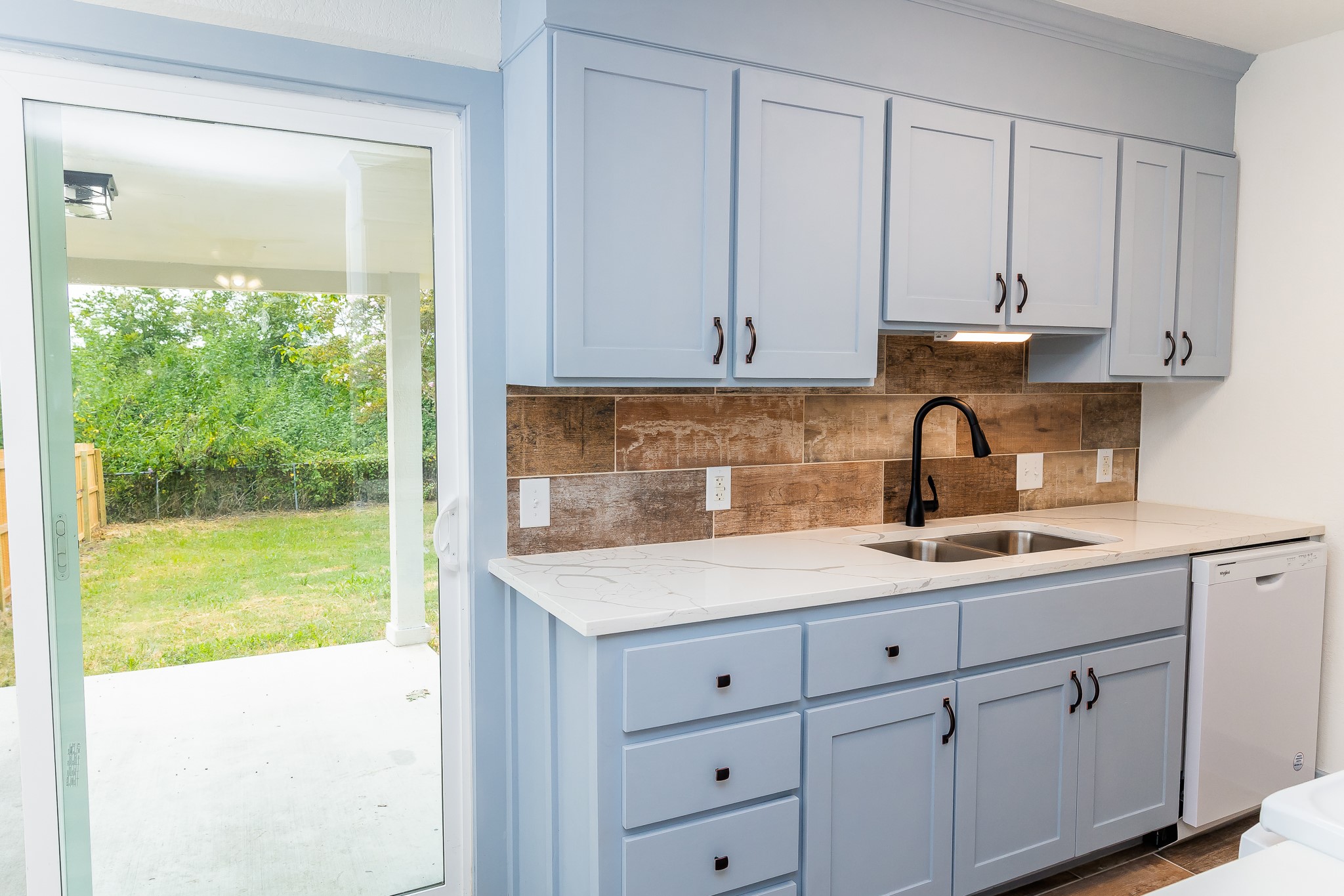 811 Matchett Street Brenham, TX 77833 - Photo 4 of 18 a kitchen with a sink and cabinets