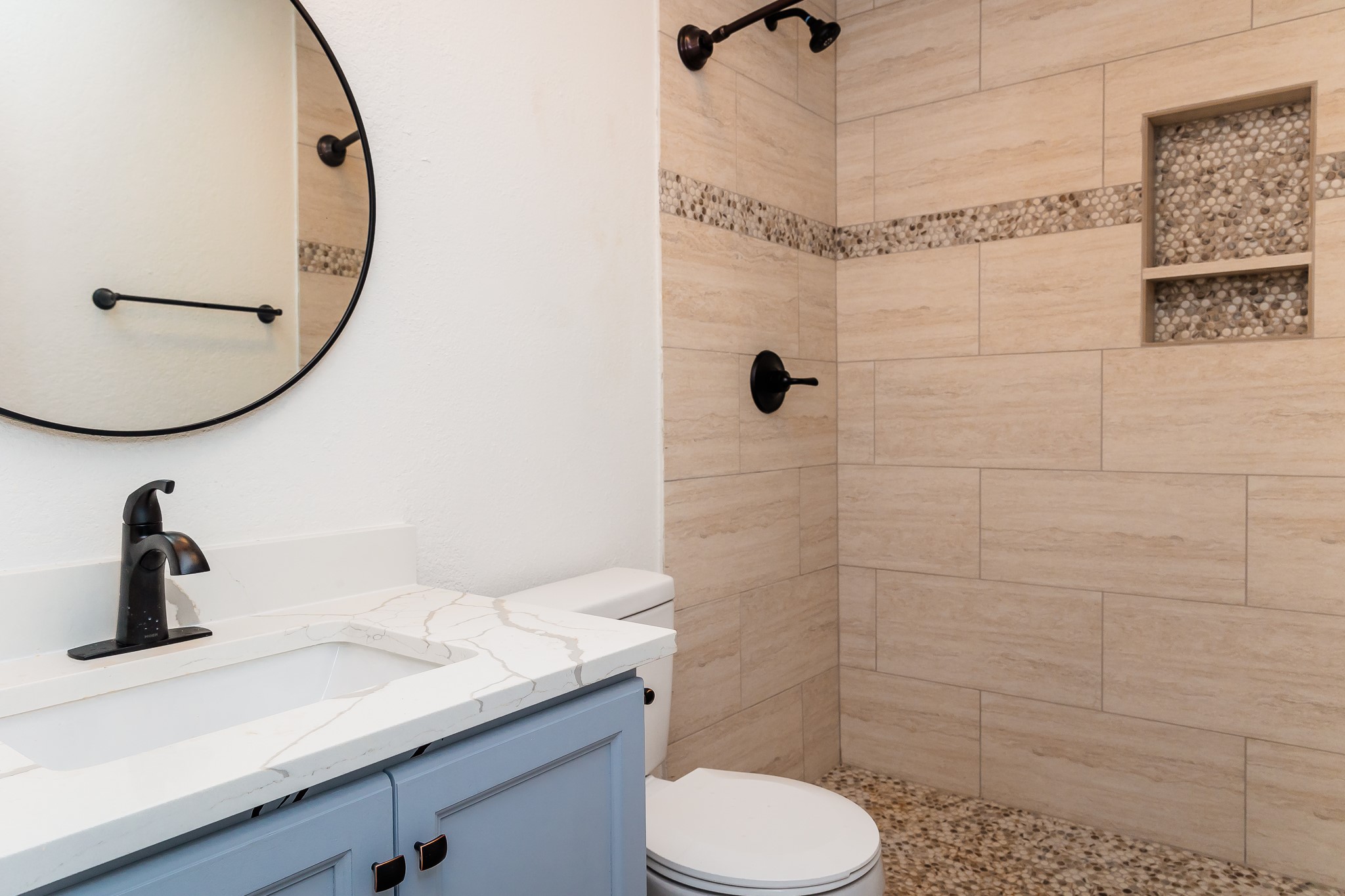811 Matchett Street Brenham, TX 77833 - Photo 8 of 18 a bathroom with a sink a toilet and a mirror