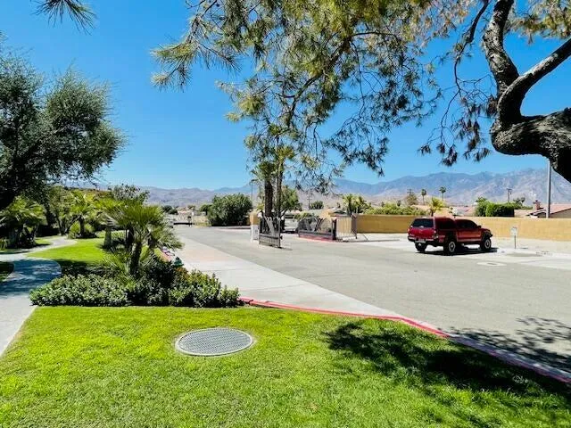 a view of a street with cars