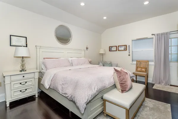 a bedroom with a bed and a couch